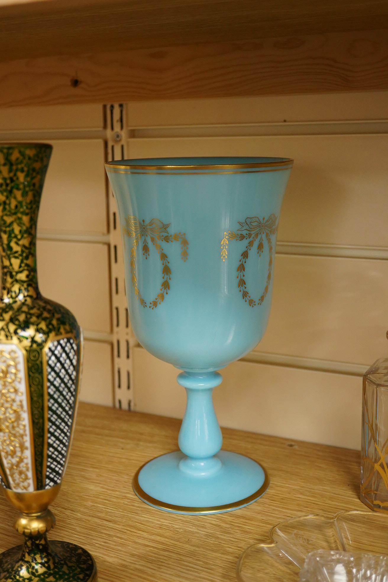 A Victorian gilt and enamelled green glass decanter, a similar vase, a small square decanter, Venetian dishes, silver plated coasters, etc